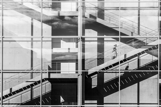 A black and white photo of a building with stairs