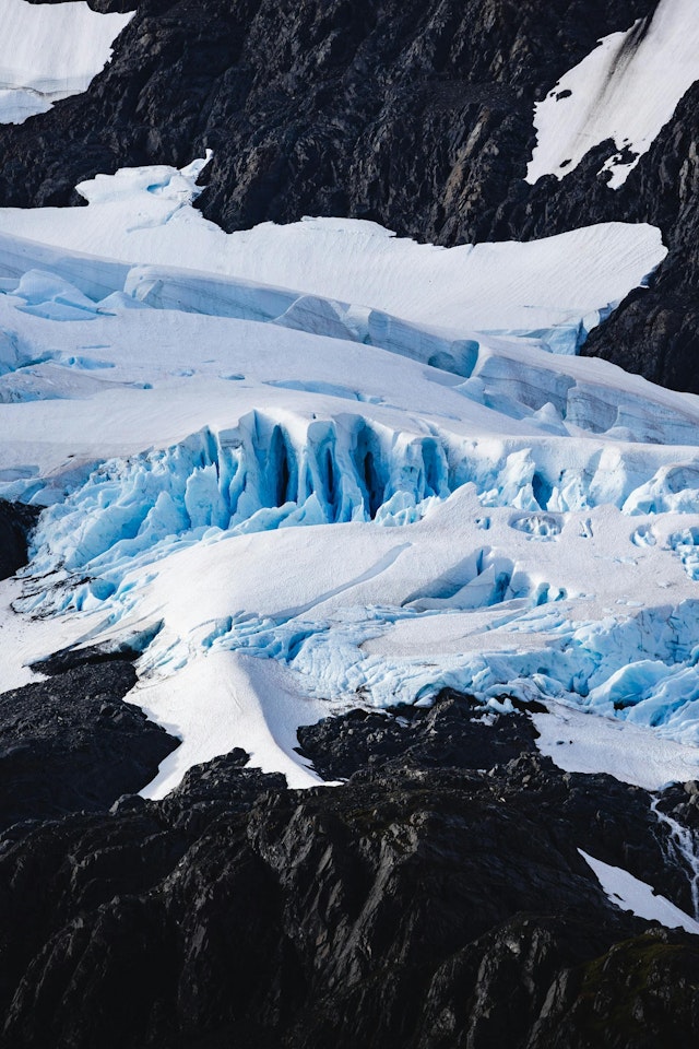 A large glacier with blue ice and snow